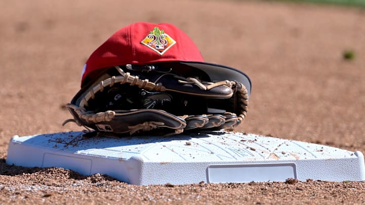 Feb 21, 2026; Phoenix, Arizona, USA;  The glove and hat of Cleveland Guardians third baseman Daniel Schneemann (10) rests on the base against the Milwaukee Brewers at American Family Fields of Phoenix. Mandatory Credit: Jayne Kamin-Oncea-Imagn Images