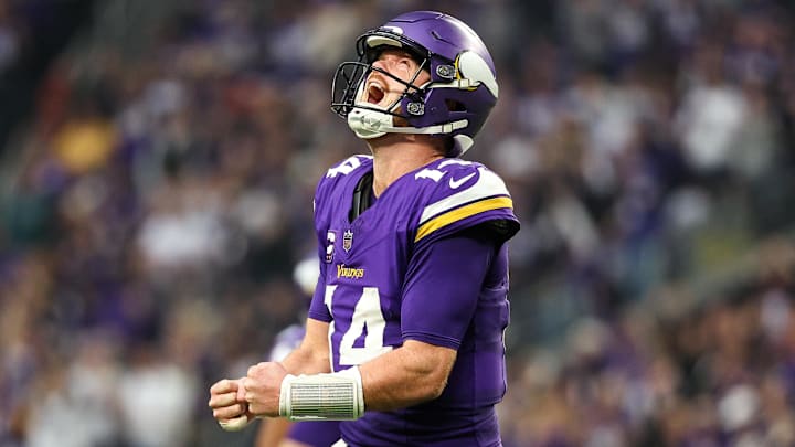 Dec 8, 2024; Minneapolis, Minnesota, USA; Minnesota Vikings quarterback Sam Darnold (14) celebrates his touchdown to wide receiver Jordan Addison (3) during the fourth quarter against the Atlanta Falcons at U.S. Bank Stadium.