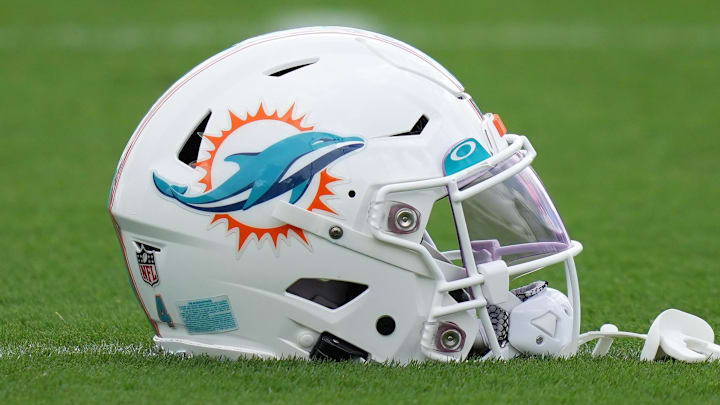 Aug 3, 2022; Miami Gardens, Florida, US; A general view of a Miami Dolphins helmet on the field during training camp at Baptist Health Training Complex. Mandatory Credit: Jasen Vinlove-Imagn Images Aug 3, 2022; Miami Gardens, Florida, US; A general view of a Miami Dolphins helmet on the field during training camp at Baptist Health Training Complex. Mandatory Credit: Jasen Vinlove-Imagn Images