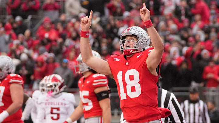 Ohio State Buckeyes quarterback Will Howard celebrates a touchdown by TreVeyon Henderson against the Indiana Hoosiers at Ohio Stadium on Nov. 23, 2024. Ohio State won 38-15.