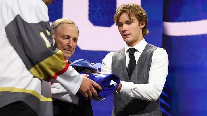 Jun 26, 2026; Buffalo, New York, USA; Gavin McKenna talks to NHL commissioner Gary Bettman after being selected with the first pick in the first round of the 2026 NHL Draft by the Toronto Maple Leafs at KeyBank Center. Mandatory Credit: Timothy T. Ludwig-Imagn Images