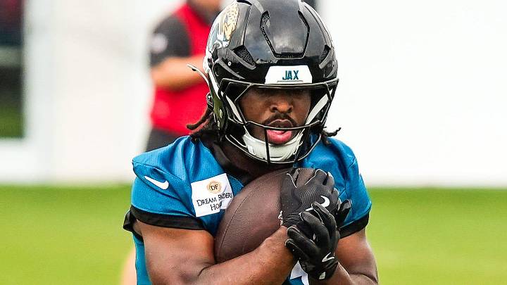Jacksonville Jaguars running back Bhayshul Tuten (33) runs with the ball during the second day of minicamp at the Miller Electric Center, Wednesday, June 10, 2026, in Jacksonville. 