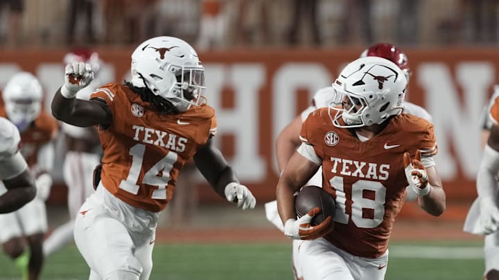 Texas Longhorns linebacker Liona Lefau (18) runs for after recovering a fumble during the second half against the Arkansas Razorbacks at Darrell K Royal-Texas Memorial Stadium. Mandatory Credit: Scott Wachter-Imagn Images