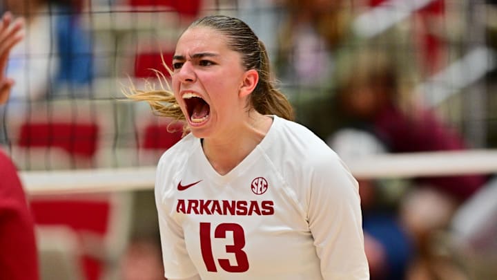 Arkansas' Kiki Remensperger celebrates after a point against the Cal Poly Mustangs. Cal Poly won in straight sets.