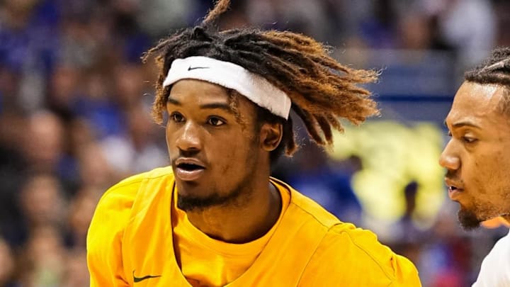 Nov 10, 2022; Lawrence, Kansas, USA; North Dakota State Bison guard Damari Wheeler-Thomas (10) drives against Kansas Jayhawks guard Bobby Pettiford Jr. (0) during the first half at Allen Fieldhouse.