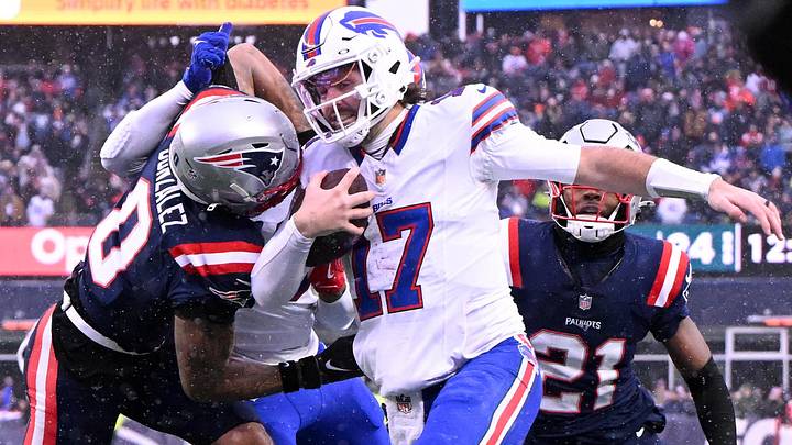 New England Patriots cornerback Christian Gonzalez (0) pushes Buffalo Bills quarterback Josh Allen (17) out of bounds during the second half at Gillette Stadium. New England Patriots cornerback Christian Gonzalez (0) pushes Buffalo Bills quarterback Josh Allen (17) out of bounds during the second half at Gillette Stadium.