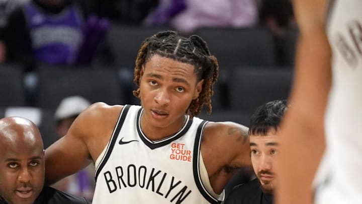 Nov 24, 2024; Sacramento, California, USA; Brooklyn Nets forward Noah Clowney (21) is helped off of the court after suffering an injury during the fourth quarter against the Sacramento Kings at Golden 1 Center. Mandatory Credit: Darren Yamashita-Imagn Images