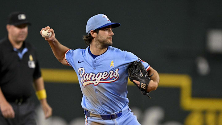 Texas Rangers shortstop Josh Smith throws the ball.