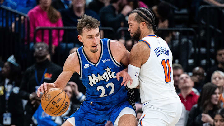 Feb 14, 2024; Orlando, Florida, USA; Orlando Magic forward Franz Wagner (22) dribbles the ball against New York Knicks guard Jalen Brunson (11) in the second quarter at KIA Center. Mandatory Credit: Jeremy Reper-Imagn Images