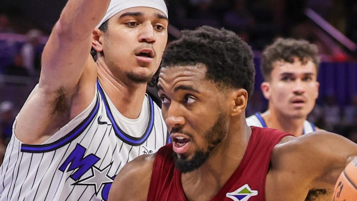 Orlando Magic guard Anthony Black defends Cleveland Cavaliers guard Donovan Mitchell.