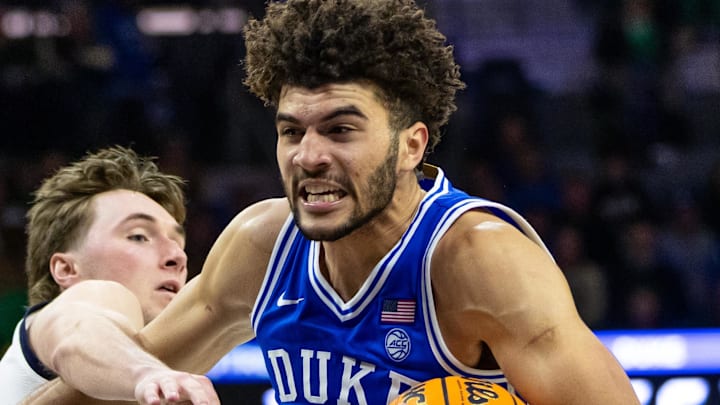 Feb 24, 2026; South Bend, Indiana, USA; Duke Blue Devils forward Cameron Boozer (12) drives as Notre Dame Fighting Irish guard Cole Certa (5) defends during the second half at Purcell Pavilion at the Joyce Center. Mandatory Credit: Michael Caterina-Imagn Images Feb 24, 2026; South Bend, Indiana, USA; Duke Blue Devils forward Cameron Boozer (12) drives as Notre Dame Fighting Irish guard Cole Certa (5) defends during the second half at Purcell Pavilion at the Joyce Center. Mandatory Credit: Michael Caterina-Imagn Images