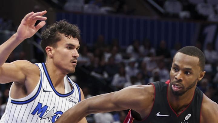  Miami Heat forward Andrew Wiggins controls the ball from Orlando Magic forward Tristan da Silva in the second quarter.