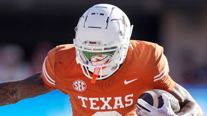 Texas Longhorns wide receiver Matthew Golden (2) stiff arms Kentucky Wildcats defensive back Maxwell Hairston (1) in the first quarter of an NCAA college football game at Darrell K Royal Texas Memorial Stadium in Austin, Texas on Saturday, Nov. 24, 2024. Texas Longhorns wide receiver Matthew Golden (2) stiff arms Kentucky Wildcats defensive back Maxwell Hairston (1) in the first quarter of an NCAA college football game at Darrell K Royal Texas Memorial Stadium in Austin, Texas on Saturday, Nov. 24, 2024.