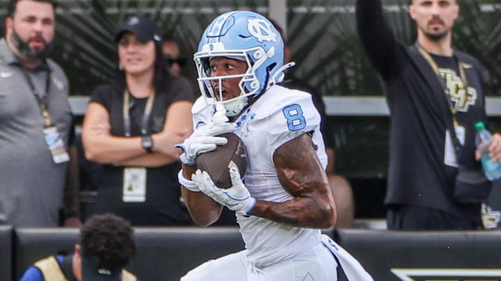 Sep 20, 2025; Orlando, Florida, USA; North Carolina Tar Heels wide receiver Kobe Paysour (8) runs the ball during the second half against the UCF Knights at the Bounce House Stadium. Mandatory Credit: Mike Watters-Imagn Images Sep 20, 2025; Orlando, Florida, USA; North Carolina Tar Heels wide receiver Kobe Paysour (8) runs the ball during the second half against the UCF Knights at the Bounce House Stadium. Mandatory Credit: Mike Watters-Imagn Images