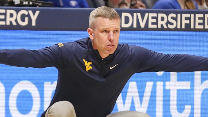 Feb 28, 2026; Morgantown, West Virginia, USA; West Virginia Mountaineers head coach Ross Hodge watched a play from the sideline during the first half against the BYU Cougars at Hope Coliseum. Mandatory Credit: Ben Queen-Imagn Images
