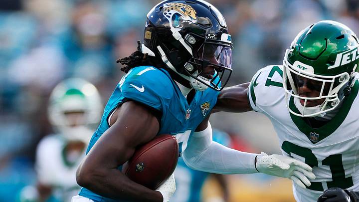 Jacksonville Jaguars wide receiver Brian Thomas Jr. (7) hauls in a reception against New York Jets cornerback Brandon Stephens (21) during the third quarter of a NFL football matchup at EverBank Stadium, Sunday, Dec. 14, 2025, in Jacksonville, Fla. The Jaguars defeated the Jets 48-20. [Corey Perrine/Florida Times-Union]
