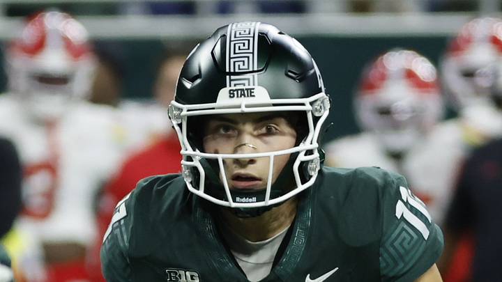 Michigan State Spartans quarterback Alessio Milivojevic (11) rolls out and looks to throw during a game against the Maryland Terrapins at Ford Field in Detroit on Saturday, Nov. 29, 2025. Michigan State Spartans quarterback Alessio Milivojevic (11) rolls out and looks to throw during a game against the Maryland Terrapins at Ford Field in Detroit on Saturday, Nov. 29, 2025.