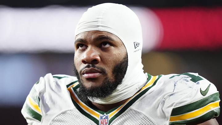 Dec 14, 2025; Denver, Colorado, USA; Green Bay Packers defensive end Micah Parsons (1) walks off the field with help from medical personnel following an injury during the third quarter against the Denver Broncos at Empower Field at Mile High. Mandatory Credit: Ron Chenoy-Imagn Images