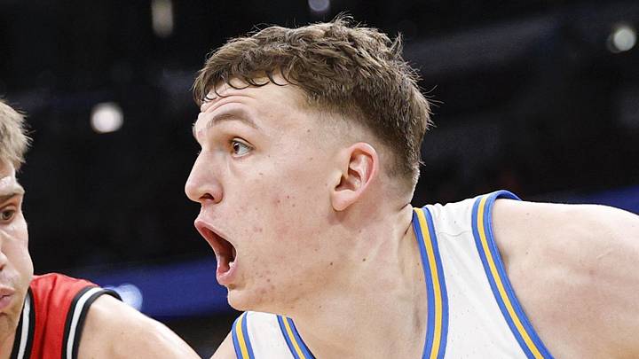 Mar 12, 2026; Chicago, IL, USA; UCLA Bruins forward Tyler Bilodeau (34) drives to the basket against Rutgers Scarlet Knights guard Harun Zrno (13) during the second half at United Center. Mandatory Credit: Kamil Krzaczynski-Imagn Images Mar 12, 2026; Chicago, IL, USA; UCLA Bruins forward Tyler Bilodeau (34) drives to the basket against Rutgers Scarlet Knights guard Harun Zrno (13) during the second half at United Center. Mandatory Credit: Kamil Krzaczynski-Imagn Images