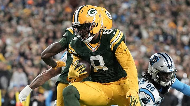 Green Bay Packers running back Josh Jacobs (8) rushes for a touchdown against the Carolina Panthers. Green Bay Packers running back Josh Jacobs (8) rushes for a touchdown against the Carolina Panthers.