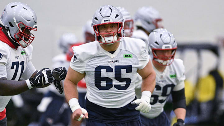 Jun 10, 2025; Foxborough, MA, USA; New England Patriots center Garrett Bradbury (65) does a drill during minicamp held in the WIN Field House at Gillette Stadium. Mandatory Credit: Eric Canha-Imagn Images