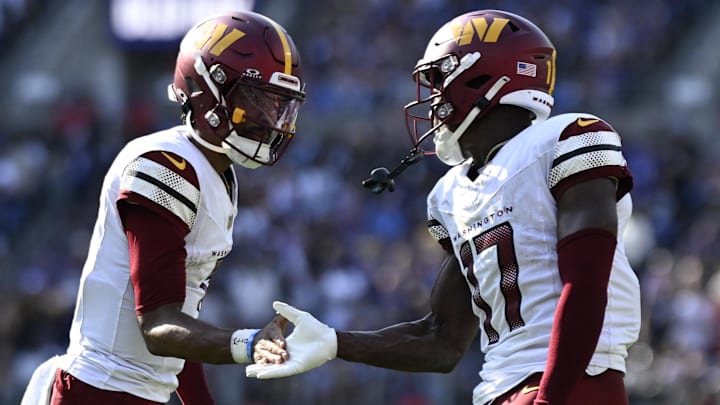 Oct 13, 2024; Baltimore, Maryland, USA;Washington Commanders quarterback Jayden Daniels (5) celebrates with Washington Commanders wide receiver Terry McLaurin (17) after catching a fourth quarter touchdown against the Baltimore Ravens at M&T Bank Stadium. Mandatory Credit: Tommy Gilligan-Imagn Images Oct 13, 2024; Baltimore, Maryland, USA;Washington Commanders quarterback Jayden Daniels (5) celebrates with Washington Commanders wide receiver Terry McLaurin (17) after catching a fourth quarter touchdown against the Baltimore Ravens at M&T Bank Stadium. Mandatory Credit: Tommy Gilligan-Imagn Images