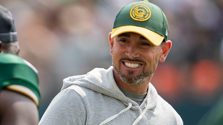 Green Bay Packers head coach Matt LaFleur shares a laugh with linebacker Kenneth Odumegwu (56) during practice on Monday, July 31, 2023, at Ray Nitschke Field in Green Bay, Wis.