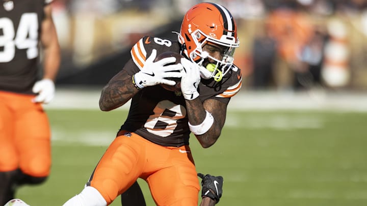 Oct 27, 2024; Cleveland, Ohio, USA; Cleveland Browns wide receiver Elijah Moore (8) makes a catch for a first down under coverage by Baltimore Ravens cornerback Brandon Stephens (21) during the fourth quarter at Huntington Bank Field. Mandatory Credit: Scott Galvin-Imagn Images