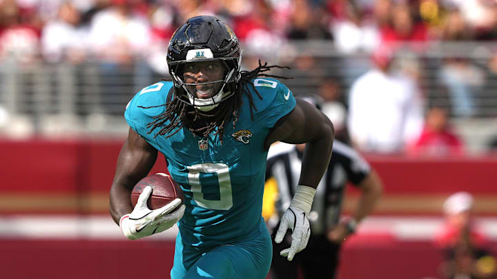 Sep 28, 2025; Santa Clara, California, USA; Jacksonville Jaguars linebacker Devin Lloyd (0) returns an interception against the San Francisco 49ers during the third quarter at Levi's Stadium. Mandatory Credit: Darren Yamashita-Imagn Images Sep 28, 2025; Santa Clara, California, USA; Jacksonville Jaguars linebacker Devin Lloyd (0) returns an interception against the San Francisco 49ers during the third quarter at Levi's Stadium. Mandatory Credit: Darren Yamashita-Imagn Images