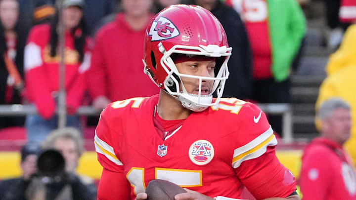 Nov 23, 2025; Kansas City, Missouri, USA; Kansas City Chiefs quarterback Patrick Mahomes (15) looks to pass against the Indianapolis Colts in overtime at GEHA Field at Arrowhead Stadium. Mandatory Credit: Denny Medley-Imagn Images