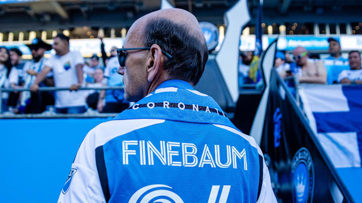 Paul Finebaum waits to get crowned at the Charlotte FC match 