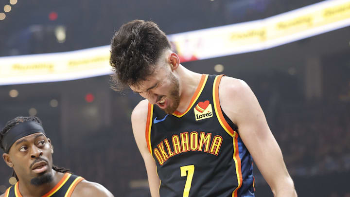 May 5, 2025; Oklahoma City, Oklahoma, USA; Oklahoma City Thunder guard Luguentz Dort (5) checks on forward Chet Holmgren (7) after he was hit during a play against the Denver Nuggets during the first quarter during game one of the second round for the 2025 NBA Playoffs at Paycom Center. Mandatory Credit: Alonzo Adams-Imagn Images
