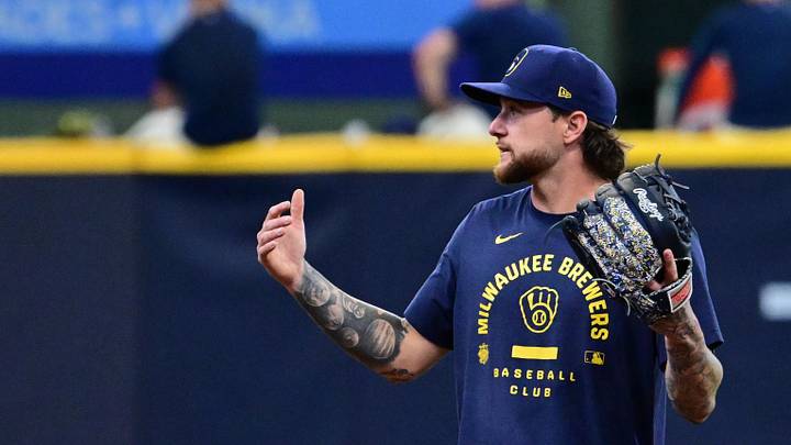 Jun 16, 2026; Milwaukee, Wisconsin, USA;  Milwaukee Brewers shortstop Cooper Pratt (12) talks to second baseman Brice Turang (2) before game against the Cleveland Guardians at American Family Field. Mandatory Credit: Benny Sieu-Imagn Images