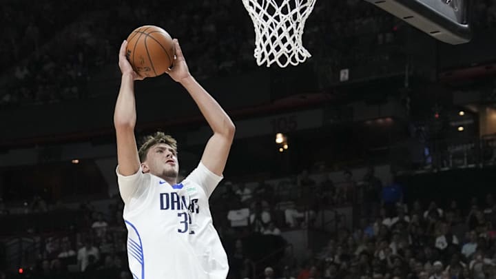 Jul 10, 2025; Las Vegas, NV, USA; Dallas Mavericks forward Cooper Flagg (32) is fouled by Los Angeles Lakers forward Cole Swider (41) in the first quarter of their game at Thomas & Mack Center. Mandatory Credit: Candice Ward-Imagn Images Jul 10, 2025; Las Vegas, NV, USA; Dallas Mavericks forward Cooper Flagg (32) is fouled by Los Angeles Lakers forward Cole Swider (41) in the first quarter of their game at Thomas & Mack Center. Mandatory Credit: Candice Ward-Imagn Images