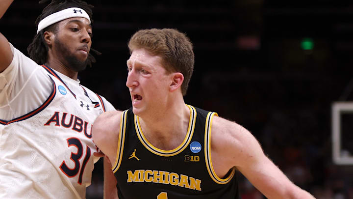 Mar 28, 2025; Atlanta, GA, USA; Michigan Wolverines center Danny Wolf (1) drives against Auburn Tigers forward Chaney Johnson (31) in the second half of a South Regional semifinal of the 2025 NCAA tournament at State Farm Arena. Mandatory Credit: Brett Davis-Imagn Images Mar 28, 2025; Atlanta, GA, USA; Michigan Wolverines center Danny Wolf (1) drives against Auburn Tigers forward Chaney Johnson (31) in the second half of a South Regional semifinal of the 2025 NCAA tournament at State Farm Arena. Mandatory Credit: Brett Davis-Imagn Images