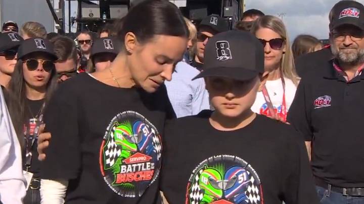 Brexton Busch, the 11-year-old son of Kyle Busch, comforts his mother, Samantha Busch, on pit road ahead of Sunday's Coca-Cola 600.