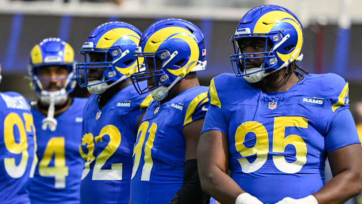 Oct 6, 2024; Inglewood, California, USA; Los Angeles Rams defensive tackle Neville Gallimore (92), defensive tackle Kobie Turner (91) and Rams defensive tackle Bobby Brown III (95) during the second quarter against the Green Bay Packers at SoFi Stadium. Mandatory Credit: Robert Hanashiro-Imagn Images Oct 6, 2024; Inglewood, California, USA; Los Angeles Rams defensive tackle Neville Gallimore (92), defensive tackle Kobie Turner (91) and Rams defensive tackle Bobby Brown III (95) during the second quarter against the Green Bay Packers at SoFi Stadium. Mandatory Credit: Robert Hanashiro-Imagn Images