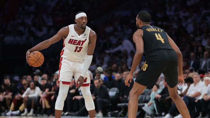 Heat center Adebayo dribbles the basketball as Cleveland Cavaliers forward Mobley defends during the first round of the 2025 NBA Playoffs.