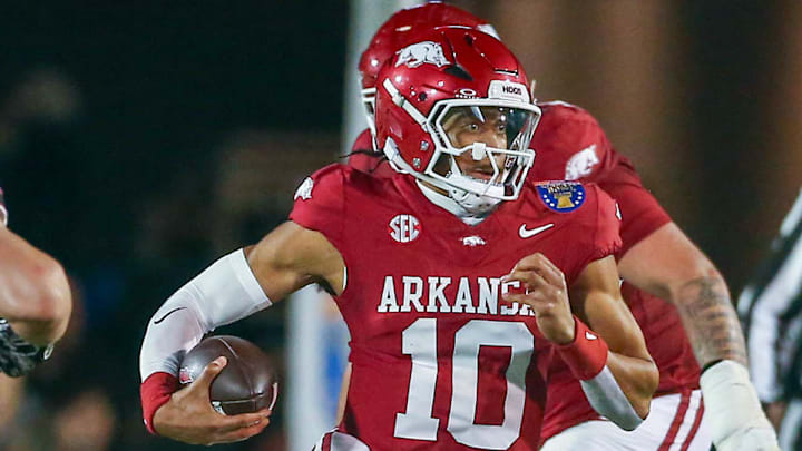 Arkansas Razorbacks quarterback Taylen Green (10) runs the ball for a first down as Texas Tech Red Raiders linebacker Charles Esters III (11) pursues during the second quarter at Simmons Bank Liberty Stadium.