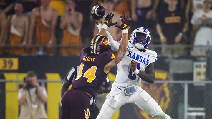 Oct 5, 2024; Tempe, Arizona, USA; Kansas Jayhawks quarterback Jalon Daniels (6) against Arizona State Sun Devils linebacker Keyshaun Elliott (44) in the second half at Mountain America Stadium. Mandatory Credit: Mark J. Rebilas-Imagn Images Oct 5, 2024; Tempe, Arizona, USA; Kansas Jayhawks quarterback Jalon Daniels (6) against Arizona State Sun Devils linebacker Keyshaun Elliott (44) in the second half at Mountain America Stadium. Mandatory Credit: Mark J. Rebilas-Imagn Images