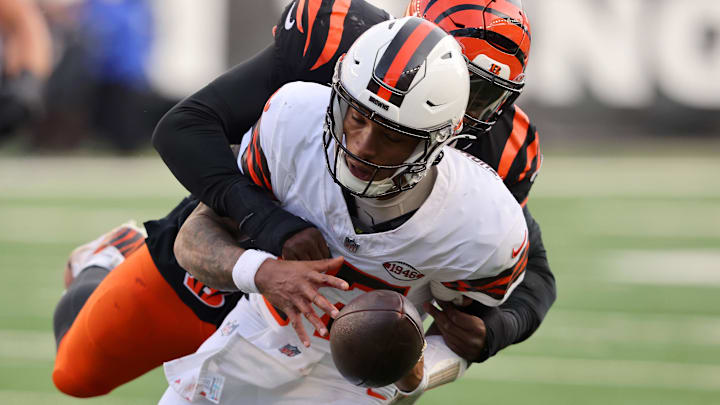 Dec 22, 2024; Cincinnati, Ohio, USA;  Cleveland Browns quarterback Dorian Thompson-Robinson (17) fumbles as Cincinnati Bengals defensive end Joseph Ossai (58) makes the tackle during the fourth quarter at Paycor Stadium. Mandatory Credit: Joseph Maiorana-Imagn Images
