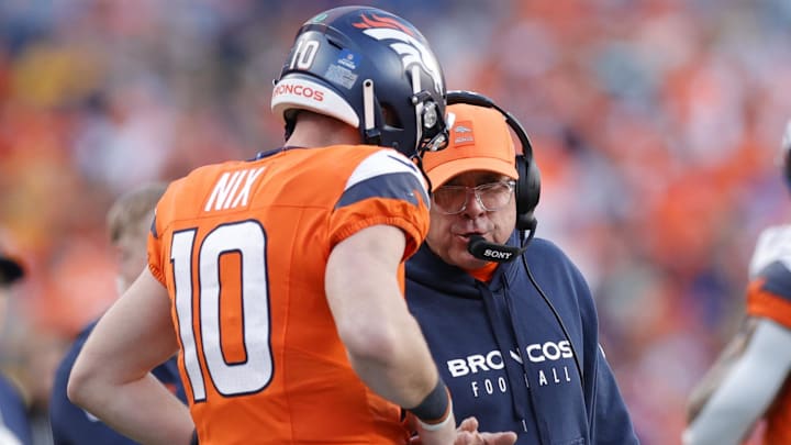 Dec 14, 2025; Denver, Colorado, USA; Denver Broncos head coach Sean Payton talks with quarterback Bo Nix (10) during the second quarter against the Green Bay Packers at Empower Field at Mile High. 