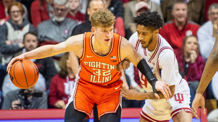 Illinois' Kasparas Jakucionis (32) works against Indiana's Kanaan Carlyle (9) during the Indiana versus Illinois men's basketball game at Simon Skjodt Assembly Hall on Tuesday, Jan. 14, 2025. Illinois' Kasparas Jakucionis (32) works against Indiana's Kanaan Carlyle (9) during the Indiana versus Illinois men's basketball game at Simon Skjodt Assembly Hall on Tuesday, Jan. 14, 2025.