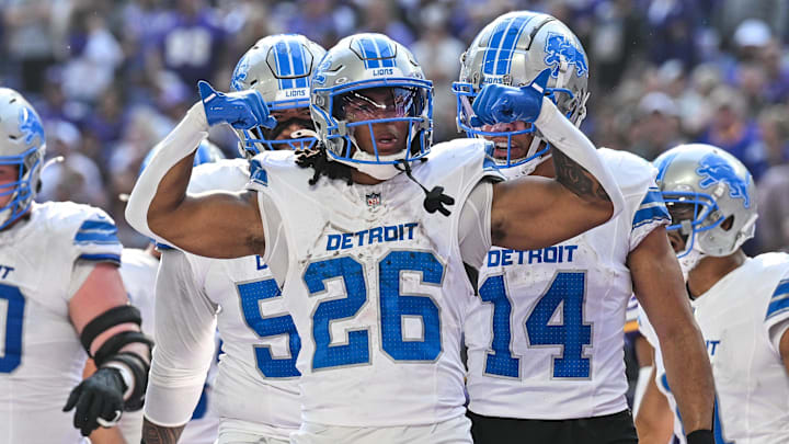 Detroit Lions running back Jahmyr Gibbs (26) celebrates with wide receiver Amon-Ra St. Brown (14) 