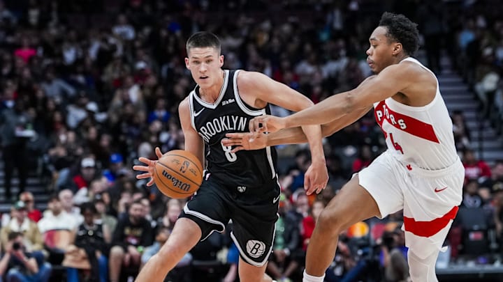 Oct 17, 2025; Toronto, Ontario, CAN; Brooklyn Nets guard Egor Dëmin (8) dribbles the ball against Toronto Raptors forward/guard Scottie Barnes (4) during the second quarter at Scotiabank Arena. Mandatory Credit: Kevin Sousa-Imagn Images