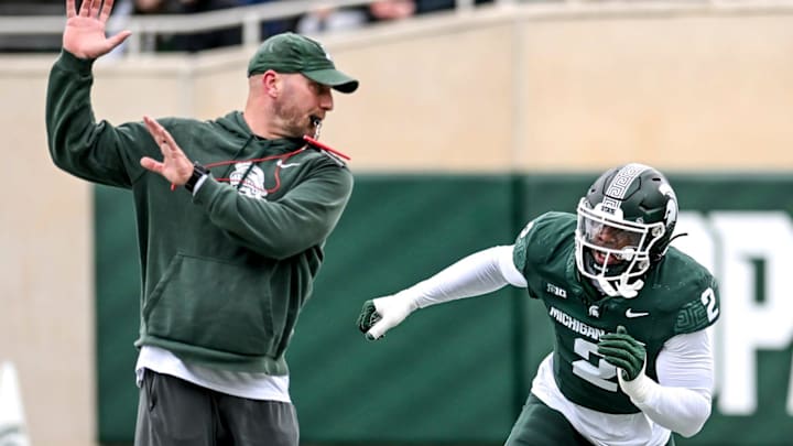 Michigan State's Khris Bogle, right, runs a drill with rush ends coach Chad Wilt during the Spring Showcase on Saturday, April 20, 2024, at Spartan Stadium in East Lansing.