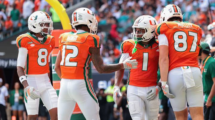 Oct 24, 2026; Miami Gardens, Florida, USA; Miami Hurricanes wide receiver Malachi Toney (1) celebrates with wide receiver Somourian Wingo (12), tight end Gavin Mueller (87) and wide receiver Vandrevius Jacobs (8) after scoring a touchdown against the Pittsburgh Panthers during the second quarter at Hard Rock Stadium. Mandatory Credit: Sam Navarro-Imagn Images Oct 24, 2026; Miami Gardens, Florida, USA; Miami Hurricanes wide receiver Malachi Toney (1) celebrates with wide receiver Somourian Wingo (12), tight end Gavin Mueller (87) and wide receiver Vandrevius Jacobs (8) after scoring a touchdown against the Pittsburgh Panthers during the second quarter at Hard Rock Stadium. Mandatory Credit: Sam Navarro-Imagn Images
