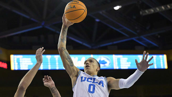 Feb 8, 2025; Los Angeles, California, USA; UCLA Bruins guard Kobe Johnson (0) drives past Penn State Nittany Lions guard Freddie Dilione V (4) in the second half at Pauley Pavilion presented by Wescom. Mandatory Credit: Jayne Kamin-Oncea-Imagn Images Feb 8, 2025; Los Angeles, California, USA; UCLA Bruins guard Kobe Johnson (0) drives past Penn State Nittany Lions guard Freddie Dilione V (4) in the second half at Pauley Pavilion presented by Wescom. Mandatory Credit: Jayne Kamin-Oncea-Imagn Images