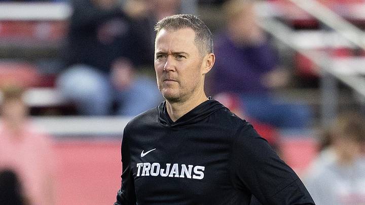 Oct 24, 2026; Madison, Wisconsin, USA;  USC Trojans head coach Lincoln Riley watches his team during warmups before the game against the Wisconsin Badgers at Camp Randall Stadium.  Mandatory Credit: Anthony Wahl-Imagn Images