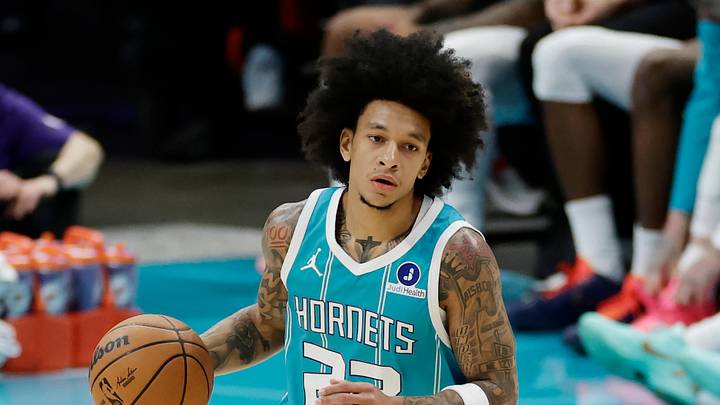 Mar 19, 2026; Charlotte, North Carolina, USA; Charlotte Hornets guard Tre Mann (23) dribbles the ball up the court during the fourth quarter against the Orlando Magic at Spectrum Center. Mandatory Credit: Brian Westerholt-Imagn Images